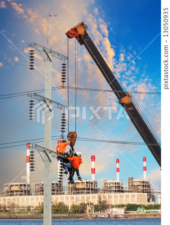 electrician worker working on high voltage electric pole with cr electrician worker working on high voltage electric pole with cr 13050935
