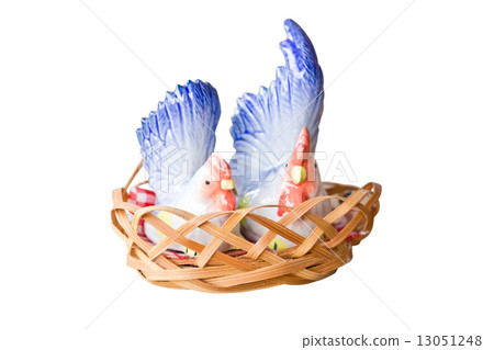 Two porcelain chicken in wooden basket. Two porcelain chicken in wooden basket. 13051248