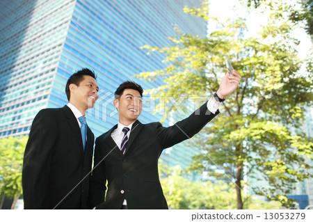 2 Business men taking a selfie 13053279