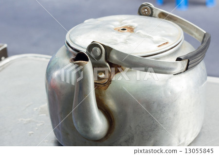 old small classic kettle on the table in thai restaurant old small classic kettle on the table in thai restaurant 13055845