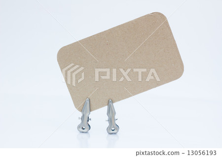 blank note on brown paper with two metal pins 13056193
