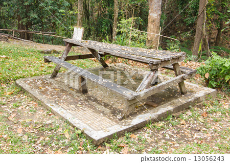 Abandoned wooden bench in thai public park 13056243