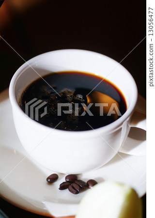 Cup of coffee with coffee beans on a beautiful background. Cup of coffee with coffee beans on a beautiful background. 13056477