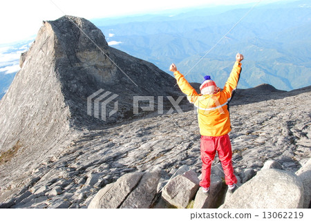 St John's peak of Mount Kinabalu and climbers (Sabah / East Malaysia / Borneo Island) 13062219