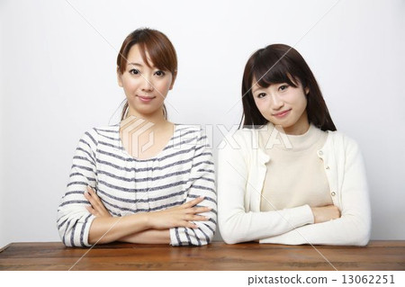 Two serious women 13062251