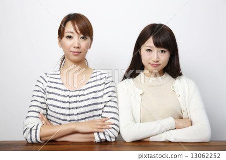 Two serious women 13062252