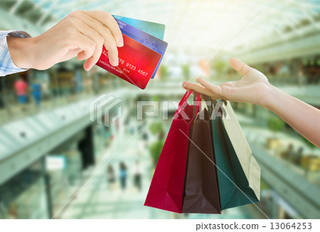 hands holding bags and credit cards hands holding bags and credit cards 13064253