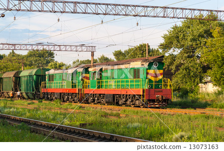 Two shunters with freight train at a station Two shunters with freight train at a station 13073163