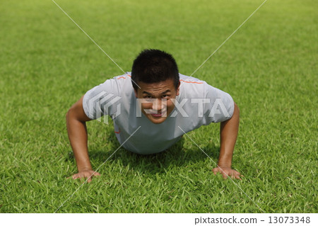 Asian men doing push-ups 13073348