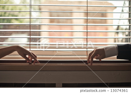 Hands on a window sill. Hands on a window sill. 13074361