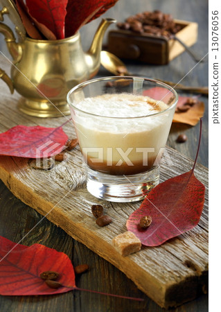Coffee cortado and autumn leaves. 13076056