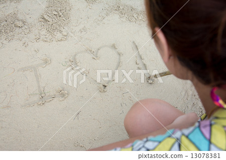 love message written in sand 13078381