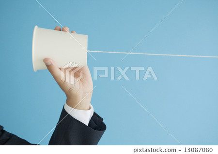 Hand of a businessman with a thread phone Hand of a businessman with a thread phone 13087080