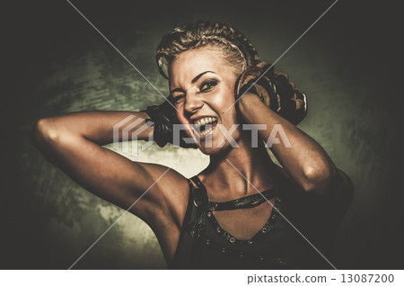 Attractive steampunk girl with headphones 13087200