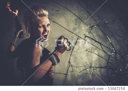 Punk girl with brass knuckles and Molotov cocktail Punk girl with brass knuckles and Molotov cocktail 13087258