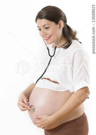 Pregnant Woman Listening her Baby Pregnant Woman Listening her Baby 13089025