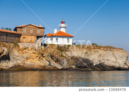 Lighthouse and wooden buildings on St. Anastasia Island 13089478