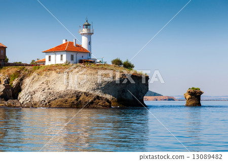 White lighthouse tower on St. Anastasia Island 13089482