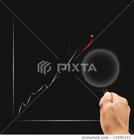 hand and magnifying on business graph 13090141