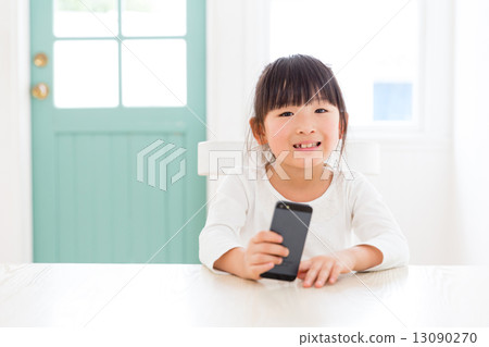 Girls using smartphones Girls using smartphones 13090270