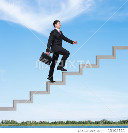 Businessman walking upstairs 13104521