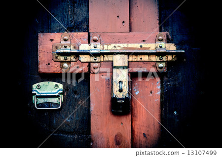 Retro vintage style picture of wooden door with lock. 13107499