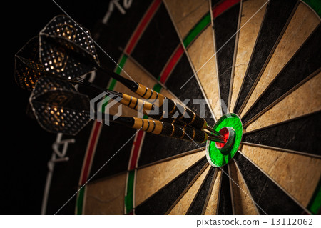 Three darts in bull's eye close up 13112062