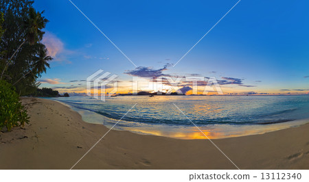 Panorama of tropical beach at sunset 13112340