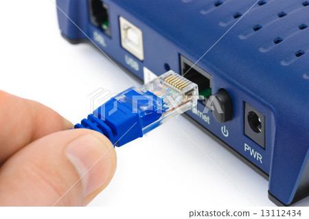 Internet cable in hand and modem Internet cable in hand and modem 13112434