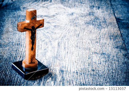 Beautiful old cross with jesus on the old wooden floor 13113037