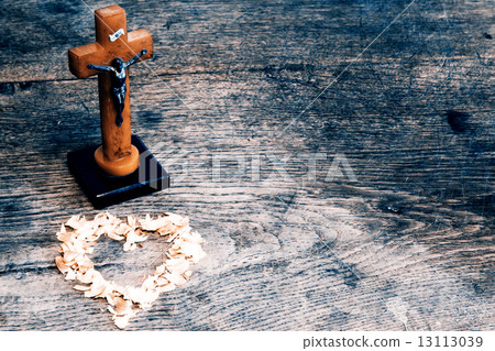 Beautiful old cross with jesus and heart from leafs on the old w 13113039