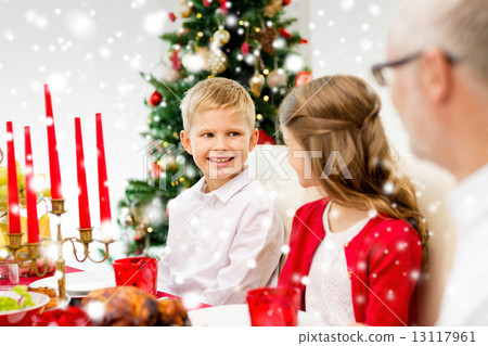 smiling family having holiday dinner at home 13117961