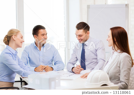 happy team of architects and designers in office 13118061
