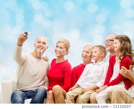 smiling family with camera smiling family with camera 13118507
