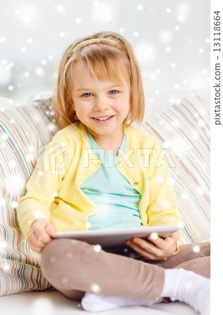 smiling girl with tablet pc computer at home smiling girl with tablet pc computer at home 13118664