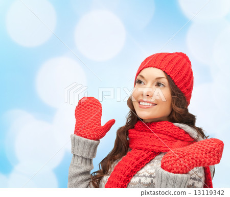 smiling young woman in winter clothes 13119342