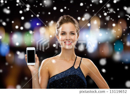 smiling woman in evening dress with smartphone smiling woman in evening dress with smartphone 13119652