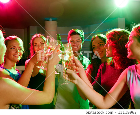 smiling friends with wine glasses and beer in club smiling friends with wine glasses and beer in club 13119962