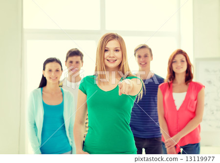 students with teenager in front pointing at you 13119977