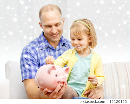 happy father and daughter with big piggy bank 13120133