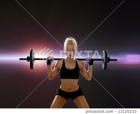 sporty woman exercising with barbell sporty woman exercising with barbell 13120233