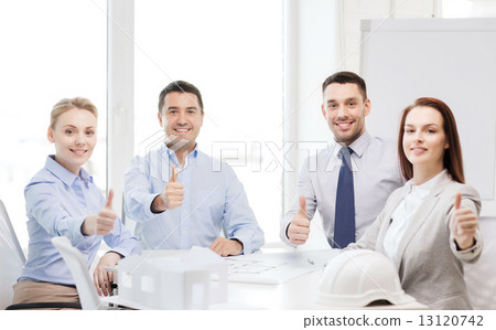 happy team of architects and designers in office 13120742