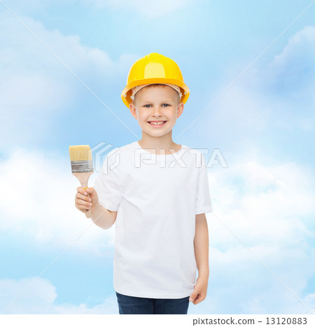 smiling little boy in helmet with paint brush 13120883