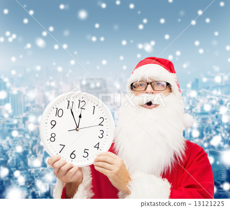 man in costume of santa claus with clock man in costume of santa claus with clock 13121225