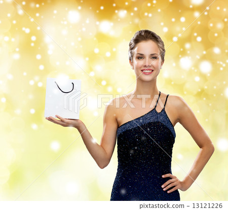 smiling woman with white blank shopping bag smiling woman with white blank shopping bag 13121226