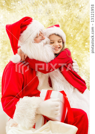 smiling little girl with santa claus 13121958