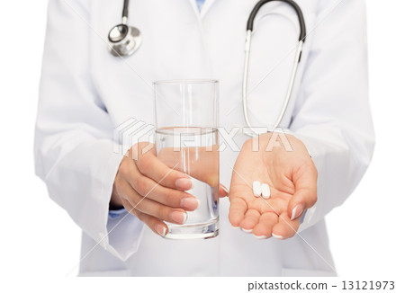 close up of doctor offering pills and water close up of doctor offering pills and water 13121973