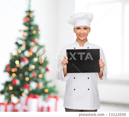 smiling female chef with black blank paper smiling female chef with black blank paper 13122030