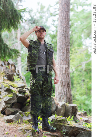 young soldier or ranger in forest young soldier or ranger in forest 13122198