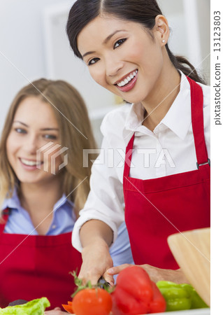 Women Friends Preparing Vegetables Salad Food in Kitchen Women Friends Preparing Vegetables Salad Food in Kitchen 13123803